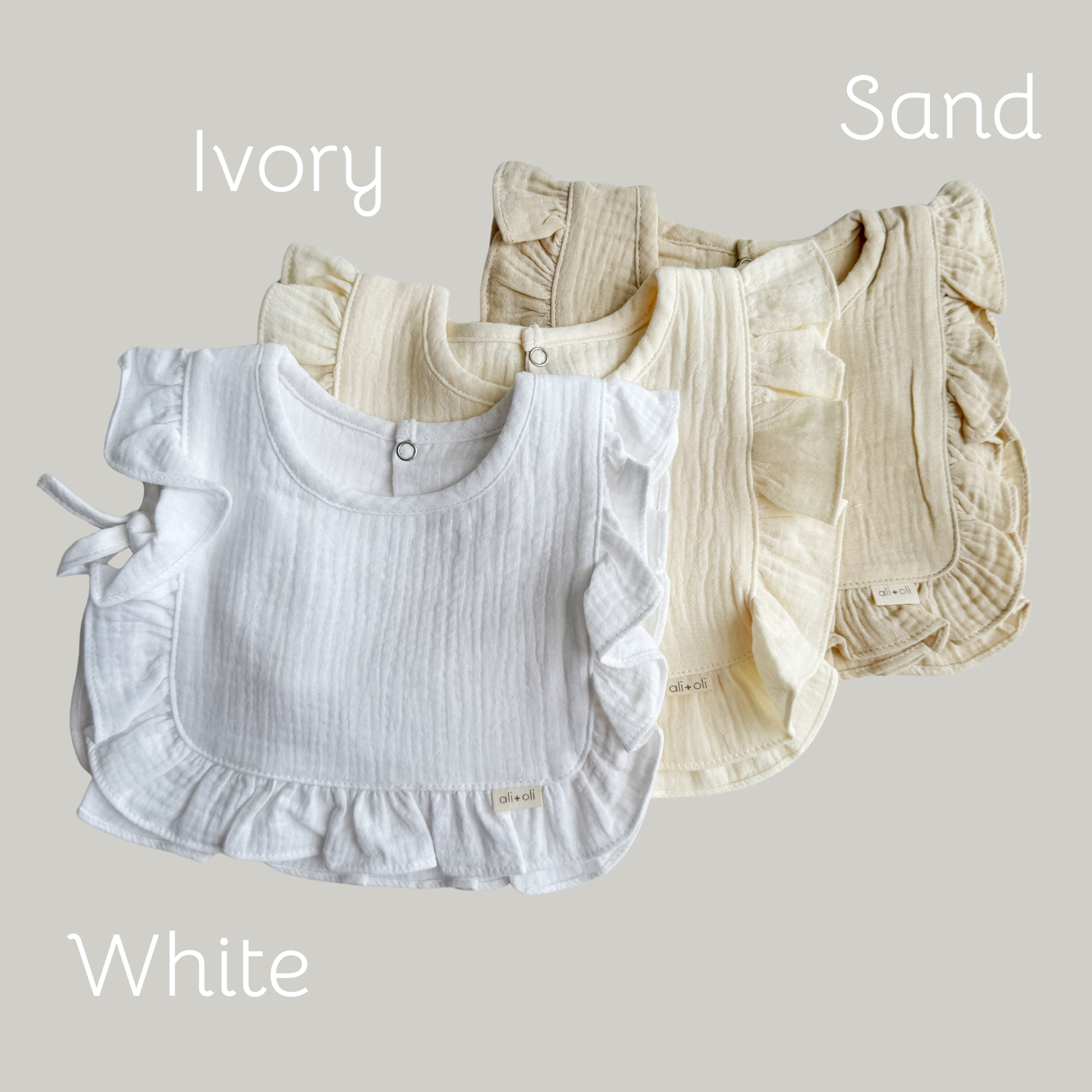 Muslin Cotton Ruffle Baby Bib (Sand) - 3 Feathers Design and Graphics & 3 Feathers Mercantile